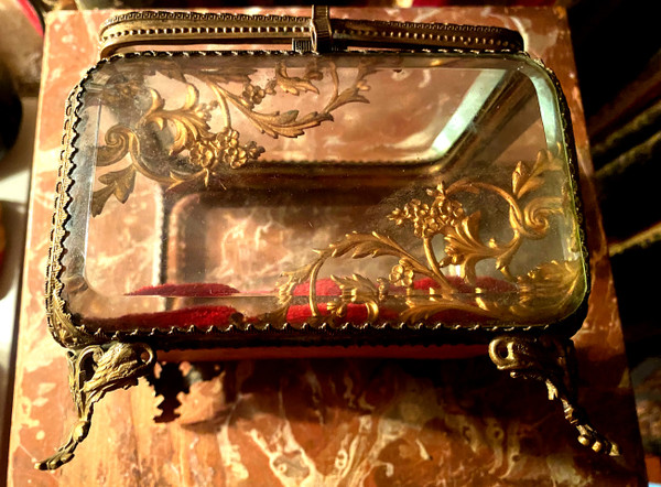 Large Napoleon III period beveled crystal jewelry box with chased bronze frame on all sides.