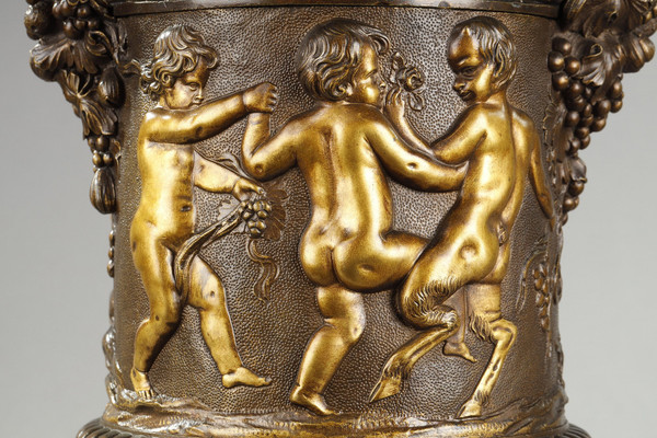 PAIR OF COVERED VASES, IN FINELY CHASED BRONZE WITH A RICH ROTATING DECORATION