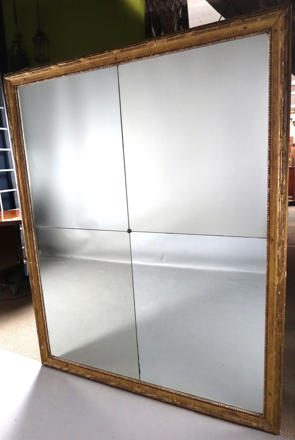 Grand miroir en bois doré fin XVIII début XIX
