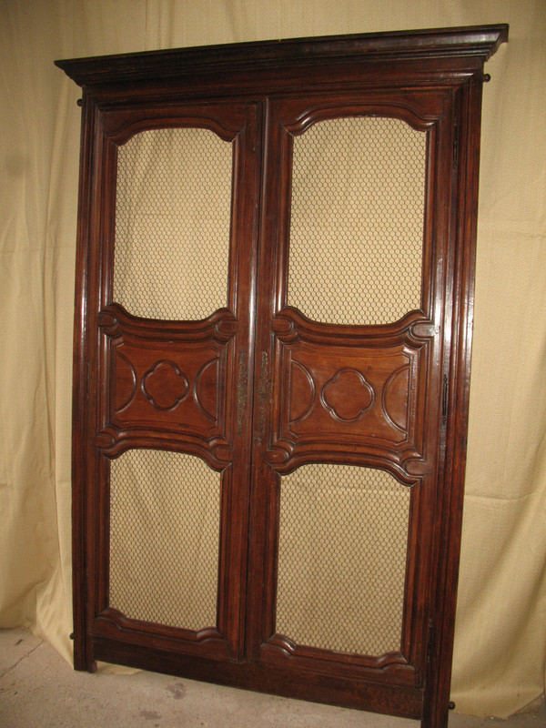 Facade of woodwork or library doors in walnut, late 18th century, Louis XIV style