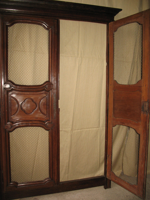 Facade of woodwork or library doors in walnut, late 18th century, Louis XIV style
