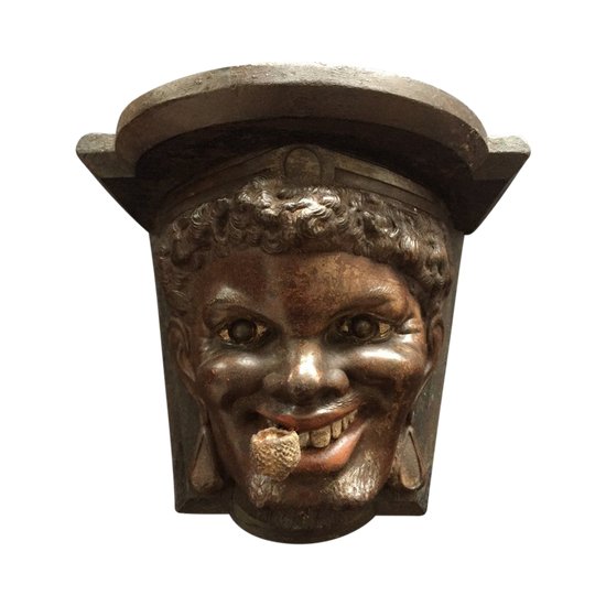 Piccola console Napoleone 3. Testa di uomo nero. XIX.