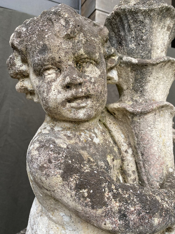 Putti (coppia) Su Base In Pietra Ricostituita XX Secolo