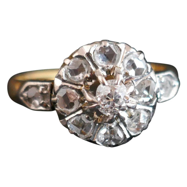 Antique Marguerite Ring Set With An Old Cut Diamond And Rose Cut Diamonds.