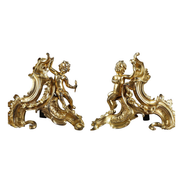 PAIR OF LOUIS XV PERIOD GILT BRONZE ANDIRONS.