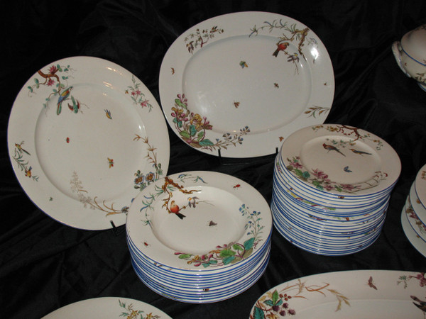 Table service in fine earthenware from Bordeaux, Nella decor with flowers and birds, 19th century