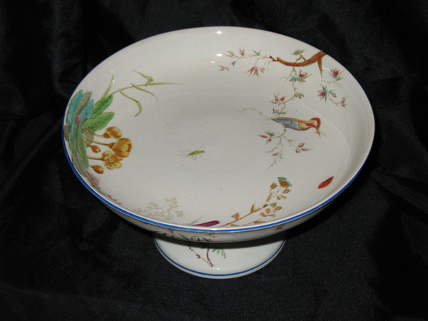 Table service in fine earthenware from Bordeaux, Nella decor with flowers and birds, 19th century