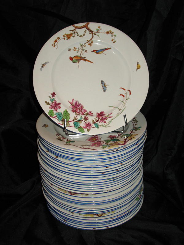 Table service in fine earthenware from Bordeaux, Nella decor with flowers and birds, 19th century