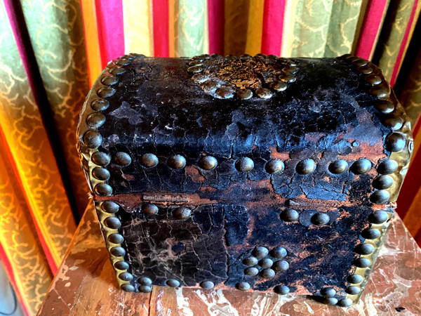 Very old wooden cassette covered in leather studded with the Arms of a Knight from the early 18th century