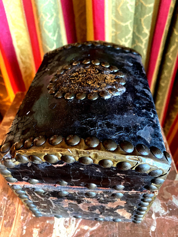 Very old wooden cassette covered in leather studded with the Arms of a Knight from the early 18th century