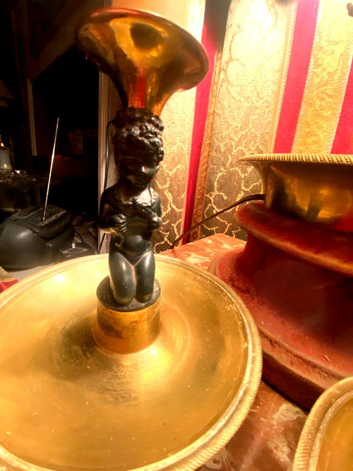 Pair of charming Empire/Restoration style table candlesticks in gilded bronze and dark green patina