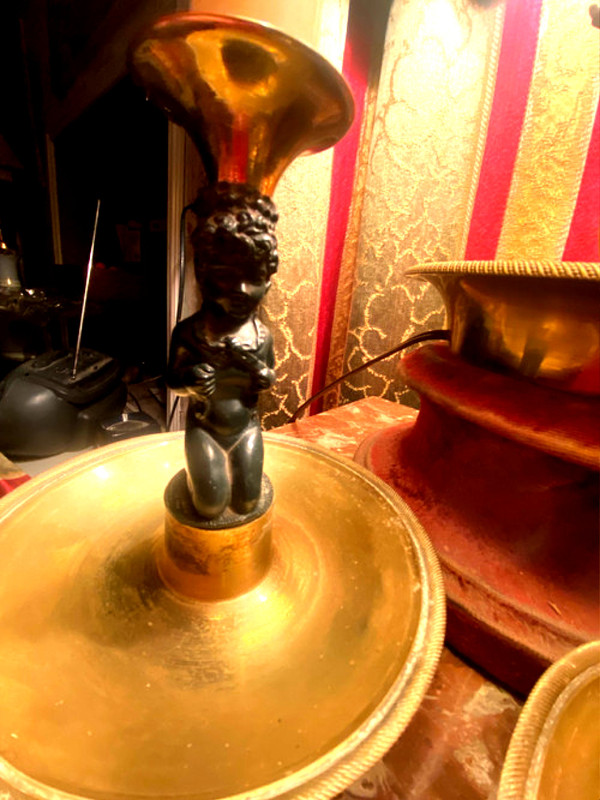 Pair of charming Empire/Restoration style table candlesticks in gilded bronze and dark green patina