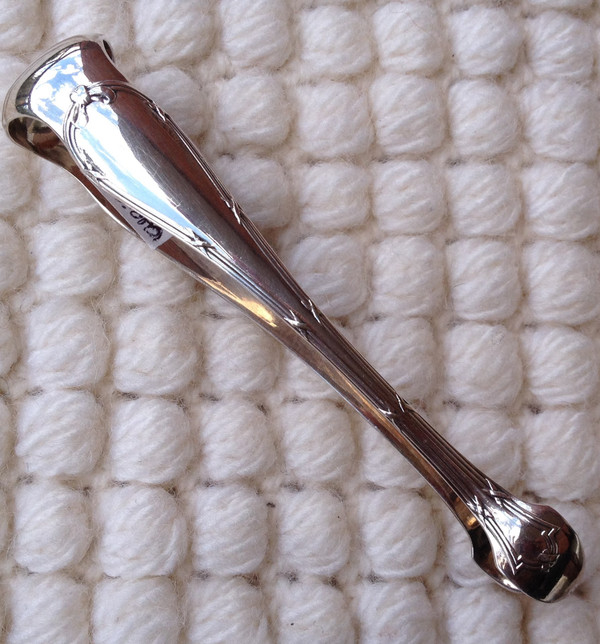 Silver metal sugar tongs model Ribbons goldsmith Christofle