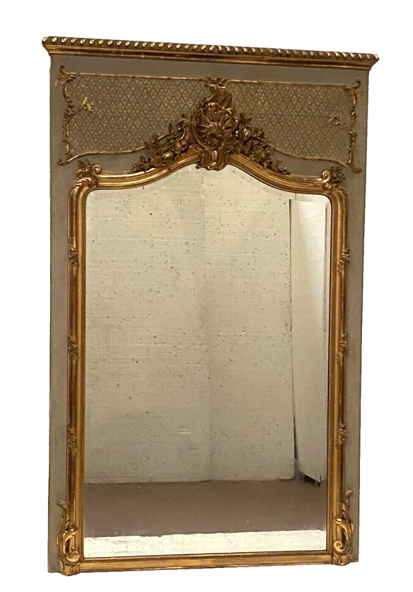 Specchiera in stile Luigi XV in legno e stucco dorato XX secolo