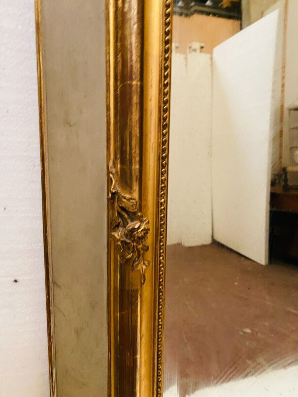 Specchiera in stile Luigi XV in legno e stucco dorato XX secolo