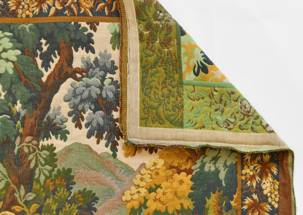 Tapestry depicting a green landscape