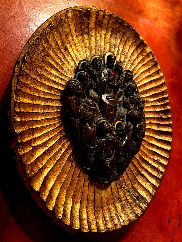 Decorative element featuring the image of Christ and his Apostles in patinated bronze with touches of colored enamel.