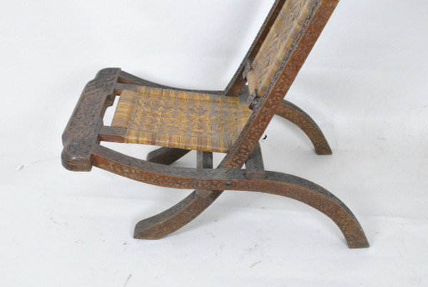 Sedia pieghevole in legno esotico intagliato e canna, Asia, Fine XIX/Inizio XX secolo