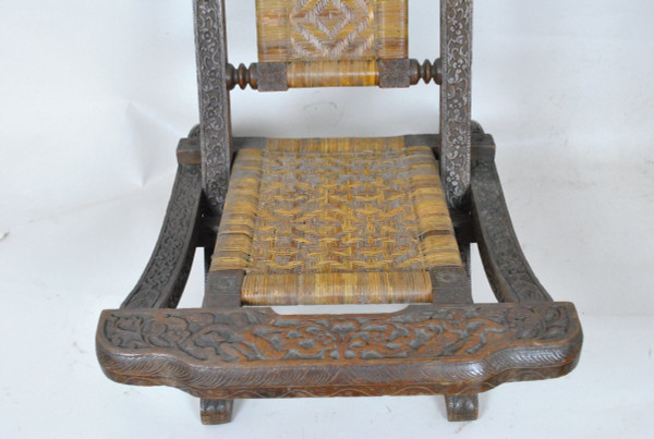Sedia pieghevole in legno esotico intagliato e canna, Asia, Fine XIX/Inizio XX secolo