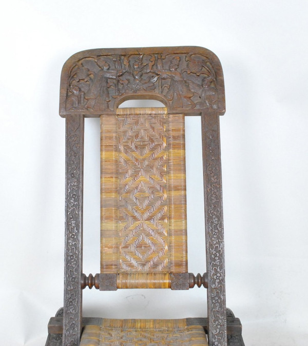 Sedia pieghevole in legno esotico intagliato e canna, Asia, Fine XIX/Inizio XX secolo