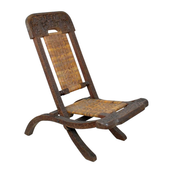 Sedia pieghevole in legno esotico intagliato e canna, Asia, Fine XIX/Inizio XX secolo
