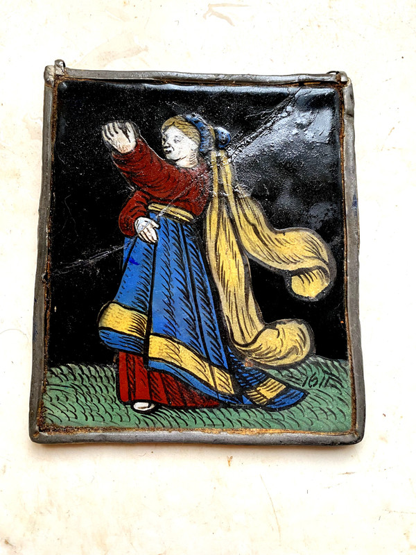 Small stained glass window from 1621 representing a woman dressed in her finery offering a present (early 17th century)