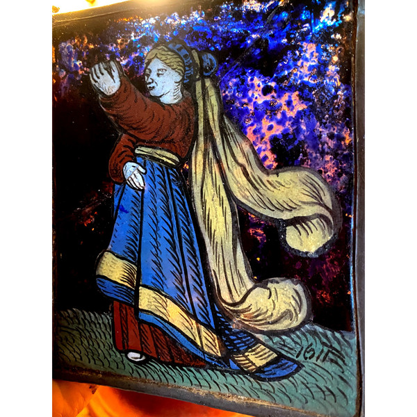 Small stained glass window from 1621 representing a woman dressed in her finery offering a present (early 17th century)