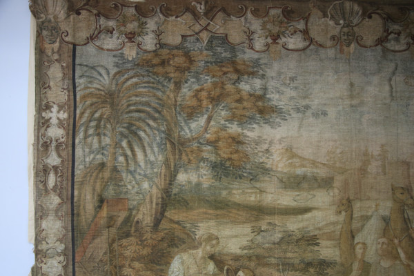 Grande toile peinte du XVIIIe, "la halte d'une caravane à un puits"