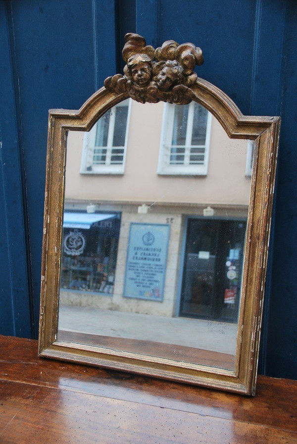 Specchio in legno dorato con teste d'angelo, XVIII secolo