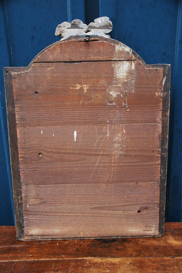 Specchio in legno dorato con teste d'angelo, XVIII secolo