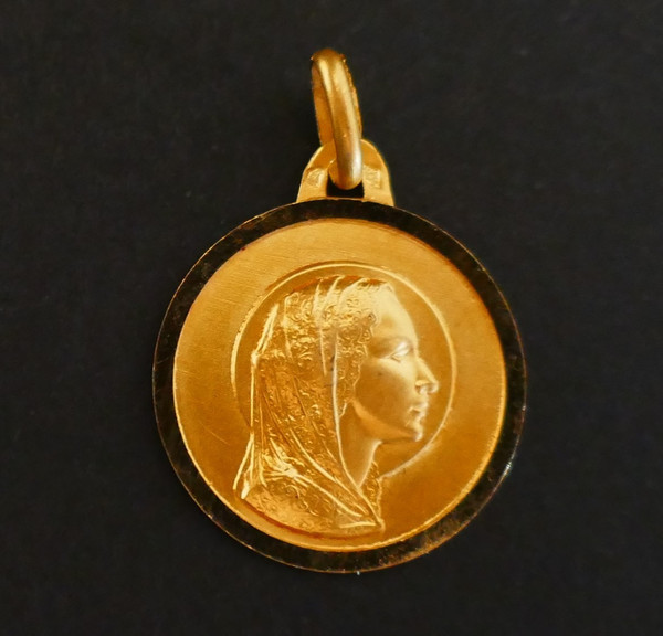 18 Carat Gold Virgin Medal.