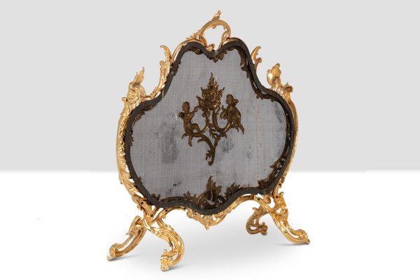 Pare-feu en bronze doré de style Louis XV. Circa 1880.