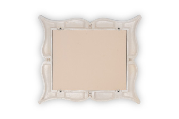 Art Deco style stucco mirror in “mustache” shape. 1990s.