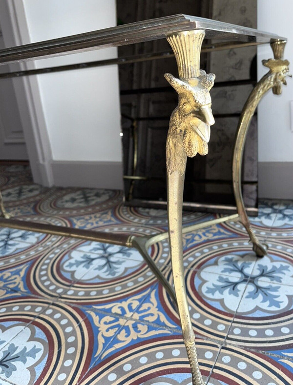 Maison CHARLES Table basse en bronze doré supportée par 4 pieds en forme de coq