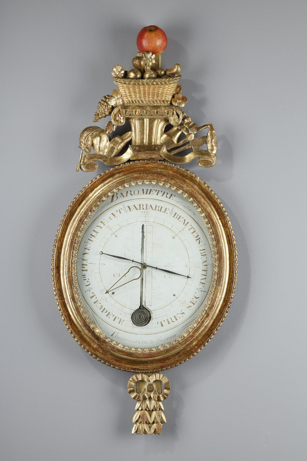 Barometer-thermometer in gilt wood, Louis XVI period