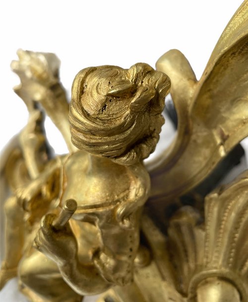 Pair of Louis XV style gilt bronze andirons representing a couple seated on rockery