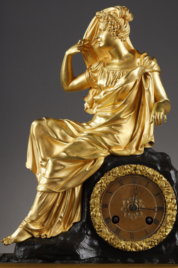 Restoration period Clock in gilt bronze with a young woman