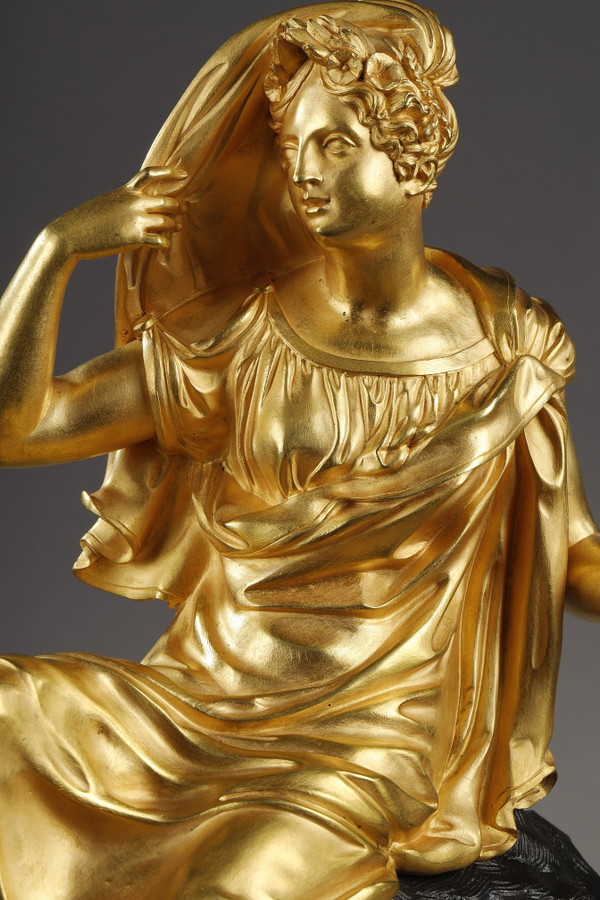 Restoration period Clock in gilt bronze with a young woman