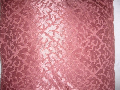Damask and braid cushion