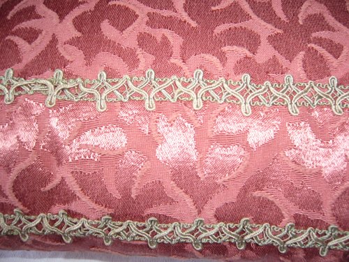 Damask and braid cushion
