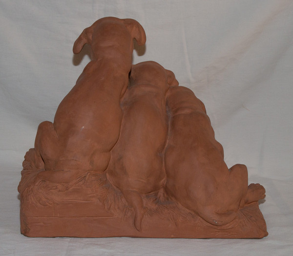 "Tre Cuccioli" in terracotta Firmato Georges Lucien Vacossin Inizio del XX secolo