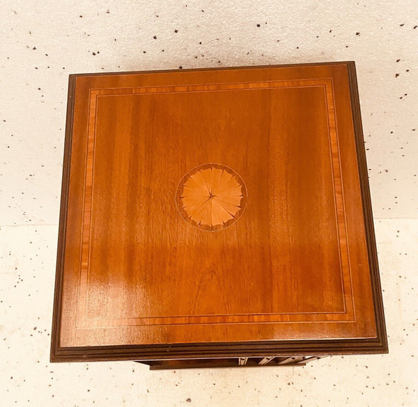 Mahogany revolving bookcase with inlaid top 20th century