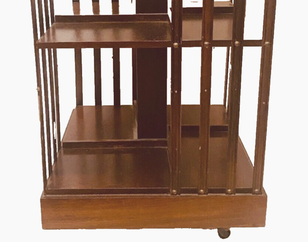 Mahogany revolving bookcase with inlaid top 20th century