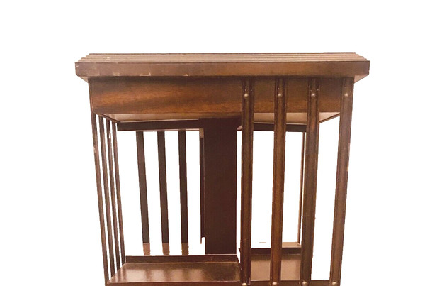 Mahogany revolving bookcase with inlaid top 20th century
