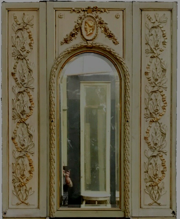 19th century patinated and gilded wood and stucco fireplace mirror