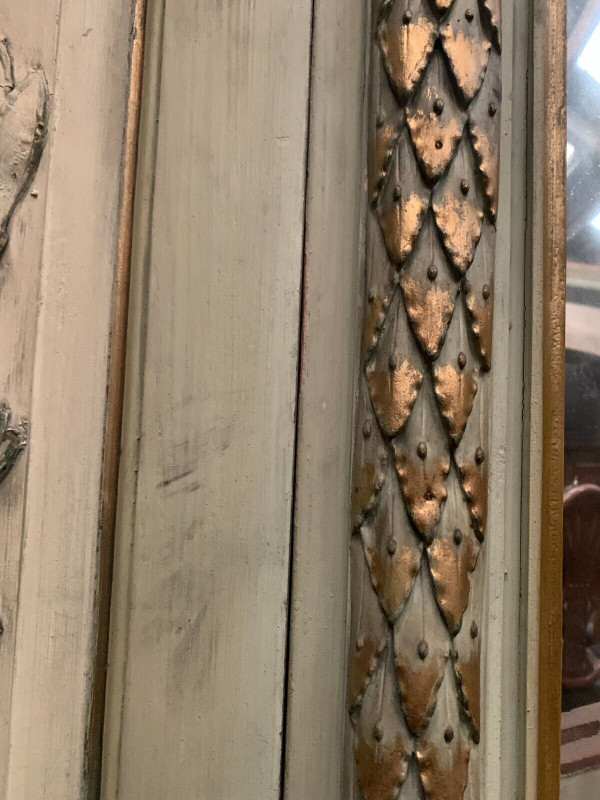 19th century patinated and gilded wood and stucco fireplace mirror