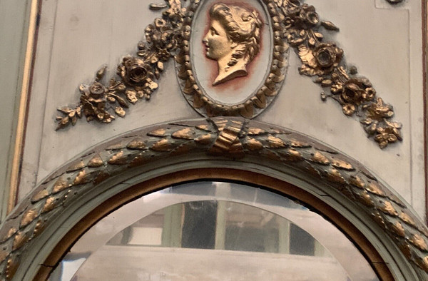 19th century patinated and gilded wood and stucco fireplace mirror
