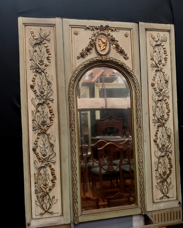 19th century patinated and gilded wood and stucco fireplace mirror