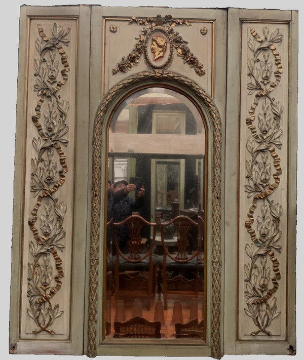 19th century patinated and gilded wood and stucco fireplace mirror