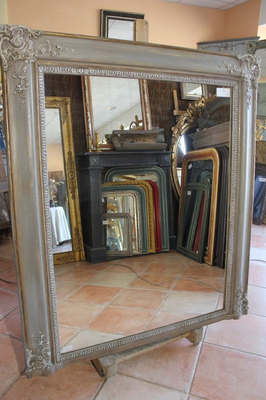 Old fireplace mirror with patina restoration